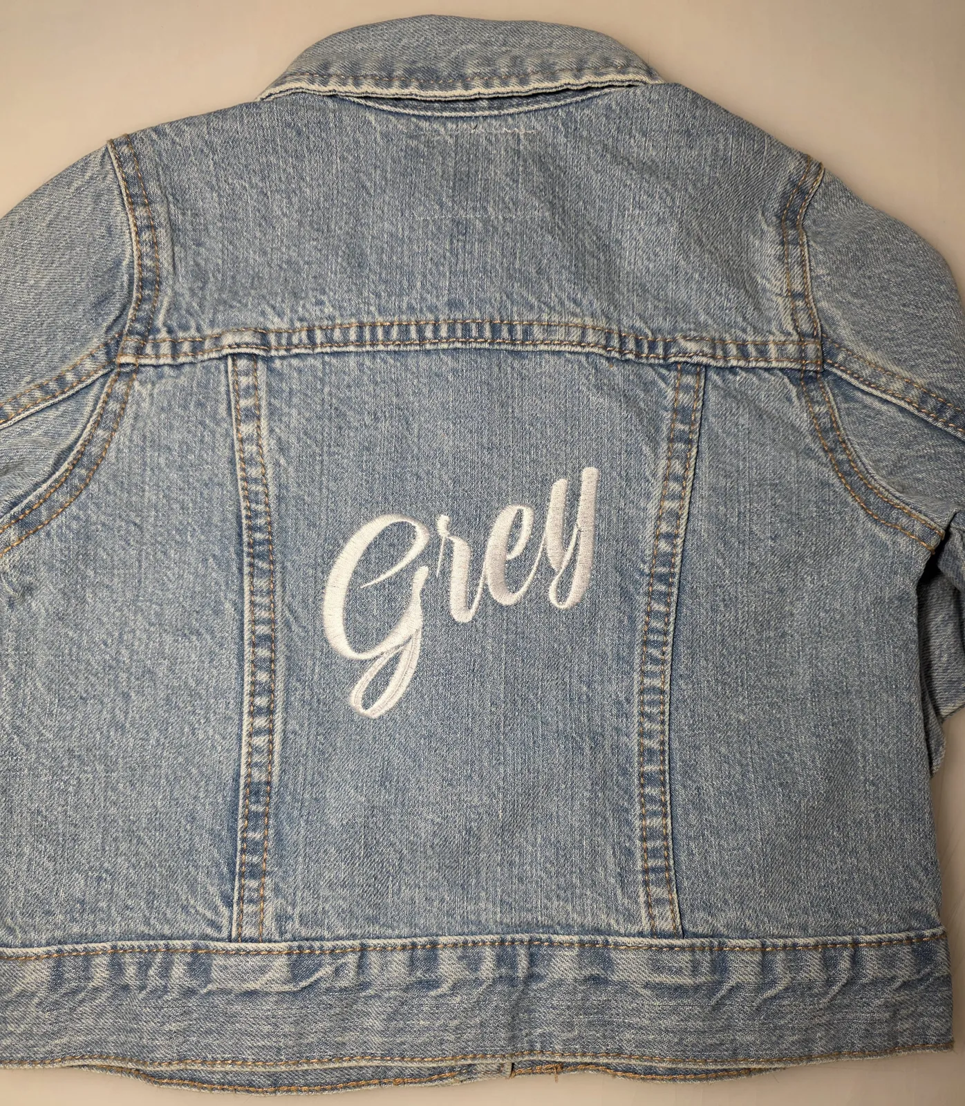 Denim jacket -- Grey cursive script