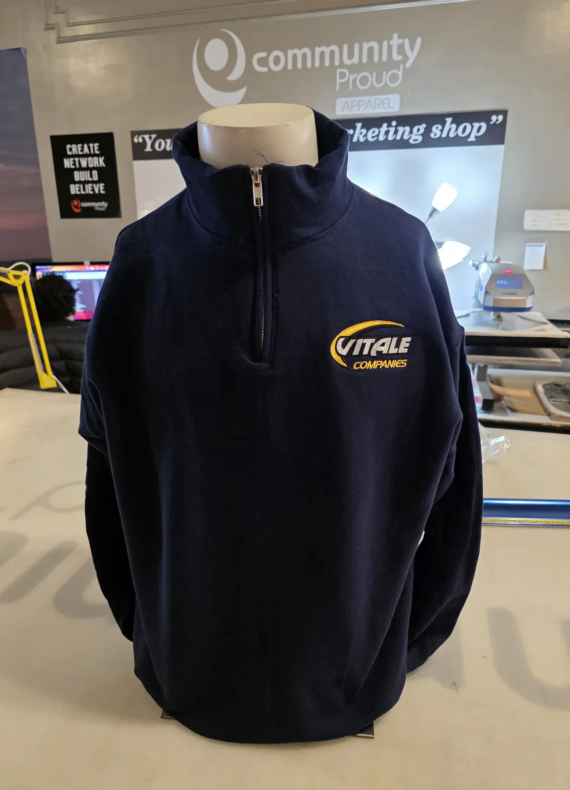 Vitale Companies navy quarter-zip fleece with embroidered ch